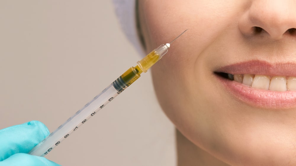 Close-up shot of a dermal filler syringe Close-up shot of a dermal filler syringe